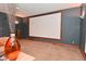 Bright living room featuring a movie screen and neutral decor at 5135 Moller Rd, Indianapolis, IN 46254