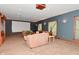 Spacious living room featuring plush seating, large windows, and a home theater projector at 5135 Moller Rd, Indianapolis, IN 46254