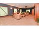 Warm and inviting living room area with comfortable seating and natural light from multiple windows at 5135 Moller Rd, Indianapolis, IN 46254