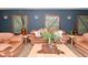Relaxing living room with couches, decorative plants and vases at 5135 Moller Rd, Indianapolis, IN 46254