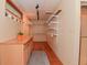 Expansive walk-in closet with custom shelving, drawers, and ample storage, catering to a fashion enthusiast's dream at 5135 Moller Rd, Indianapolis, IN 46254
