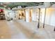 Open basement featuring visible pipes, concrete floors, and unfinished ceilings at 517 Bernard Ave, Indianapolis, IN 46208