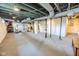 Spacious basement featuring concrete floors, unfinished ceilings, and visible ductwork at 517 Bernard Ave, Indianapolis, IN 46208