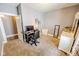 Charming bedroom featuring neutral tones, plush carpeting, and a well-lit workspace at 517 Bernard Ave, Indianapolis, IN 46208