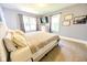 Inviting bedroom with a comfortable bed, natural light, and a mounted TV at 517 Bernard Ave, Indianapolis, IN 46208