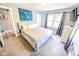 Comfortable bedroom featuring neutral tones, carpet, and a wall-mounted TV at 517 Bernard Ave, Indianapolis, IN 46208