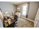 Bright bedroom featuring neutral walls and carpet; perfect space for a home office at 517 Bernard Ave, Indianapolis, IN 46208