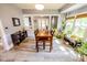 Bright dining room featuring hardwood floors, a wooden table, and many windows with lots of natural sunlight at 517 Bernard Ave, Indianapolis, IN 46208