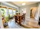 Cozy dining area with a wooden table, lots of sunlight, and open layout to the kitchen at 517 Bernard Ave, Indianapolis, IN 46208