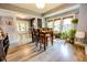 Bright dining room featuring hardwood floors, a wooden table, and many windows with lots of natural sunlight at 517 Bernard Ave, Indianapolis, IN 46208
