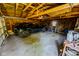 Spacious garage with a black car, ample storage, and a concrete floor at 517 Bernard Ave, Indianapolis, IN 46208