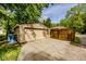 Detached garage with a large door, side entrance, and plenty of parking space at 517 Bernard Ave, Indianapolis, IN 46208