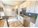 Modern kitchen featuring stainless steel appliances, granite countertops, and white cabinetry at 517 Bernard Ave, Indianapolis, IN 46208