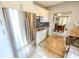 Modern kitchen featuring stainless steel appliances, granite countertops, and white cabinetry at 517 Bernard Ave, Indianapolis, IN 46208