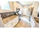 Modern kitchen featuring stainless steel appliances, granite countertops, and white cabinetry at 517 Bernard Ave, Indianapolis, IN 46208