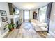 Spacious living room with contemporary design, a brick fireplace, and ample natural light at 517 Bernard Ave, Indianapolis, IN 46208