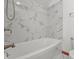 Bright bathroom featuring a toilet and a white shower with stylish white marble surround, plus a modern shower head at 5313 Redbird Dr, Columbus, IN 47201