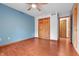 Spacious bedroom featuring hardwood floors, a large closet, and a window allowing ample natural light at 5313 Redbird Dr, Columbus, IN 47201