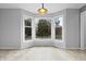 Bright breakfast nook with large bay window providing scenic backyard views and natural light at 5313 Redbird Dr, Columbus, IN 47201