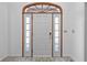 Bright foyer featuring a white front door with sidelights and decorative transom window at 5313 Redbird Dr, Columbus, IN 47201