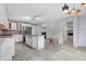 Spacious kitchen with white cabinets, granite countertops, stainless steel fridge, and center island at 5313 Redbird Dr, Columbus, IN 47201