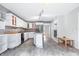 Bright kitchen featuring white cabinets, stainless steel appliances, and an island with seating at 5313 Redbird Dr, Columbus, IN 47201