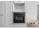 Modern kitchen oven built into cabinetry, showcasing sleek design and efficient space utilization at 5313 Redbird Dr, Columbus, IN 47201