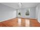 Spacious living room with hardwood floors, crown molding, and large windows offering pleasant views at 5313 Redbird Dr, Columbus, IN 47201