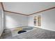 Spacious living room featuring wood floors, crown molding and french doors to another room at 5313 Redbird Dr, Columbus, IN 47201