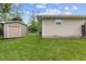 Backyard view of home and shed with lawn at 5326 Brazos Dr, Indianapolis, IN 46237