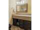 Bathroom featuring a large vanity with ample storage, large framed mirror, and tiled flooring at 5326 Brazos Dr, Indianapolis, IN 46237