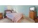 This bedroom features a queen bed, a tv, light blue walls, and carpeted flooring at 5326 Brazos Dr, Indianapolis, IN 46237