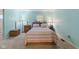 Comfortable bedroom with an aqua painted walls, carpeted floor, and natural light is perfect for resting at 5326 Brazos Dr, Indianapolis, IN 46237