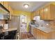 Functional kitchen boasts ample counter space, modern appliances and seamless access to the living areas at 5326 Brazos Dr, Indianapolis, IN 46237