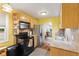 Well-lit kitchen with wooden cabinets, granite countertops, and modern appliances at 5326 Brazos Dr, Indianapolis, IN 46237