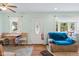 Cozy living room area features a decorative front door, wood floors and space for dining at 5326 Brazos Dr, Indianapolis, IN 46237
