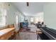 Open living area blending carpet, hardwood floors, with cozy decor and bright light at 5326 Brazos Dr, Indianapolis, IN 46237