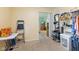 Walk-in closet with open shelving and doorway to bedroom with TV at 5326 Brazos Dr, Indianapolis, IN 46237