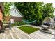 Relaxing back deck with outdoor seating and a lush green backdrop at 5401 N New Jersey St, Indianapolis, IN 46220