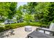 Back patio with seating and a view of the lush green yard at 5401 N New Jersey St, Indianapolis, IN 46220
