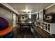 Finished basement with ping pong table, tv, shelving, and painted concrete walls at 5401 N New Jersey St, Indianapolis, IN 46220
