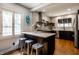 Modern kitchen with white subway tile, stainless steel appliances, and black cabinetry at 5401 N New Jersey St, Indianapolis, IN 46220