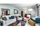 Spacious living room with comfortable seating, colorful rug, and natural light at 5401 N New Jersey St, Indianapolis, IN 46220