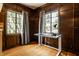 Office space featuring natural light, hardwood floors, and wood paneling at 5401 N New Jersey St, Indianapolis, IN 46220