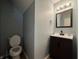 Powder room features updated sink and fixtures with fresh paint at 5502 Floating Leaf Dr, Indianapolis, IN 46237