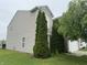 Home exterior with manicured lawn, lush greenery, and vinyl siding at 5502 Floating Leaf Dr, Indianapolis, IN 46237