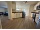 An open kitchen layout with stainless steel appliances and wood flooring at 5502 Floating Leaf Dr, Indianapolis, IN 46237