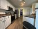 A view of the kitchen with stainless appliances and plenty of counter space at 5502 Floating Leaf Dr, Indianapolis, IN 46237