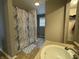 Close up view of shower in the main bathroom with a single sink vanity at 5502 Floating Leaf Dr, Indianapolis, IN 46237