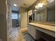 This main bathroom has a shower and single sink vanity at 5502 Floating Leaf Dr, Indianapolis, IN 46237